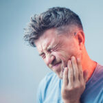 man with tooth pain