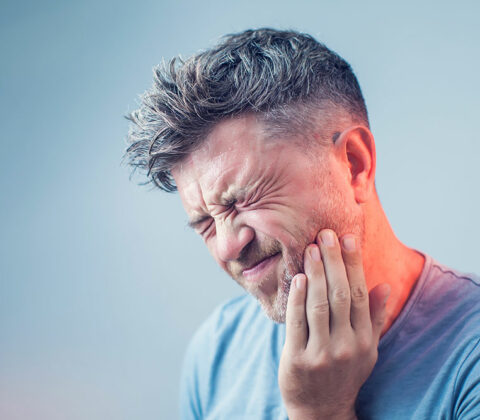 man with tooth pain