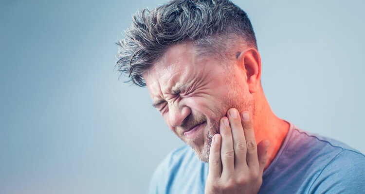 man with tooth pain