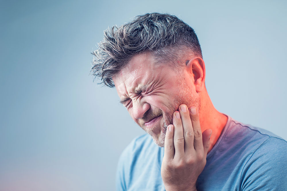 man with tooth pain