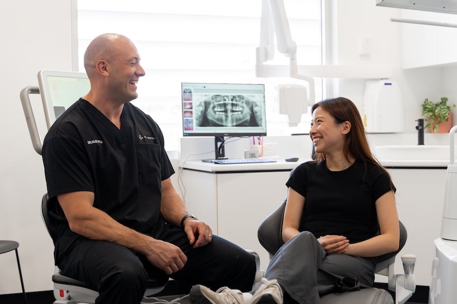 Dentist talking to patient