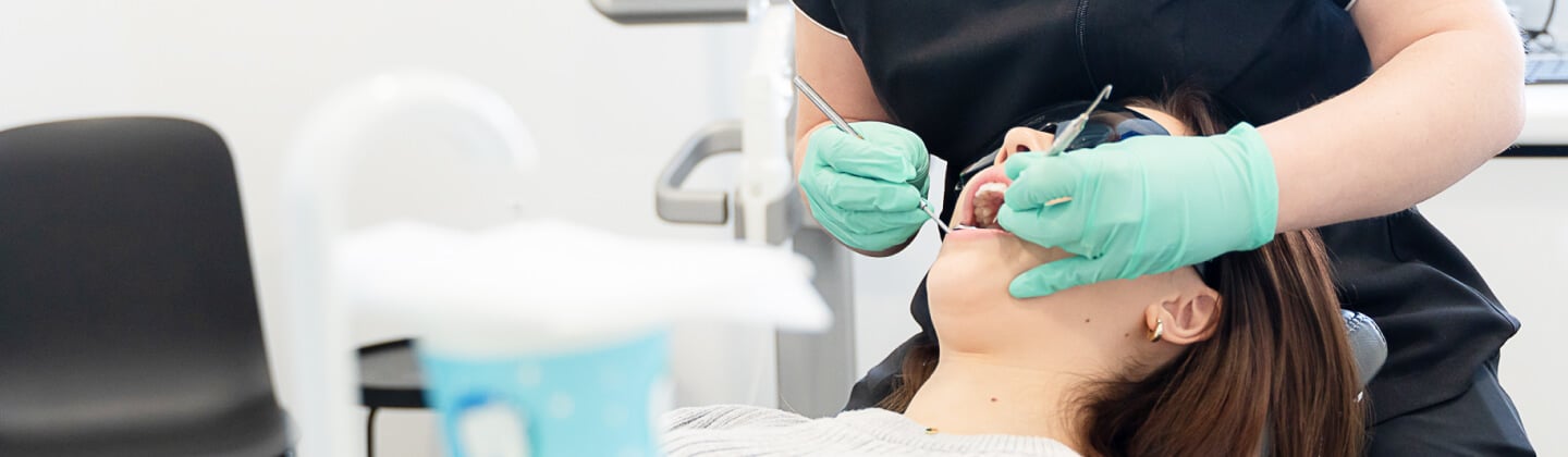 Dentist performing emergency dental treatment on a patient