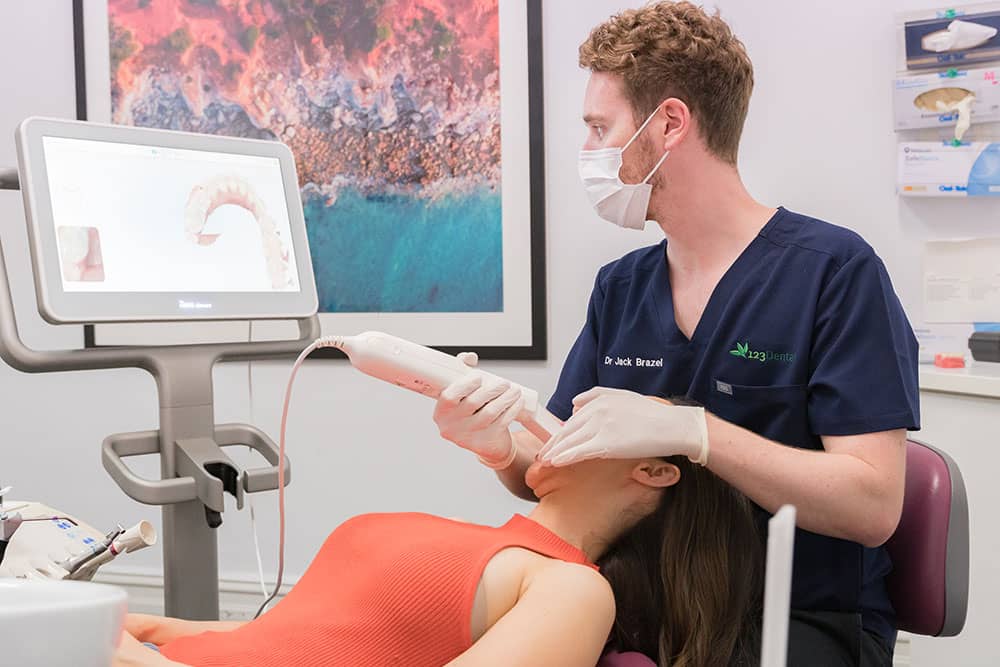 Dentist viewing results with patient