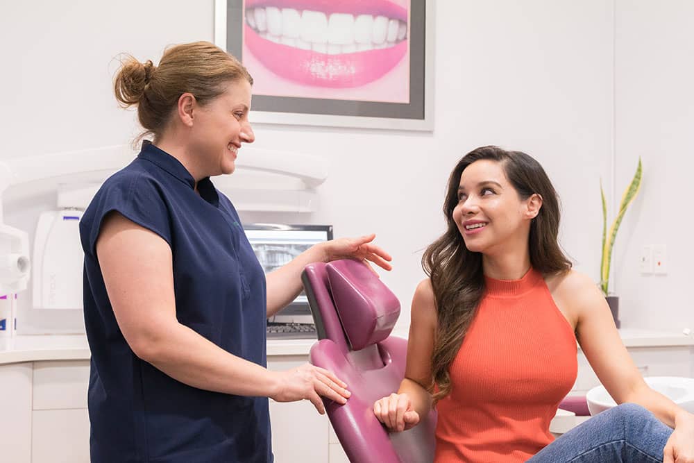 Dental nurse with patient
