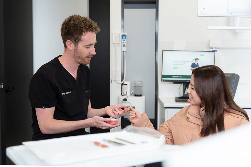 a patient discussing invisalign with a dentist