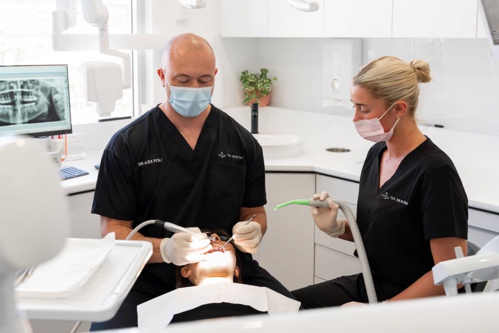 Experienced dentist at 123 Dental performing a professional scale and clean treatment in Perth